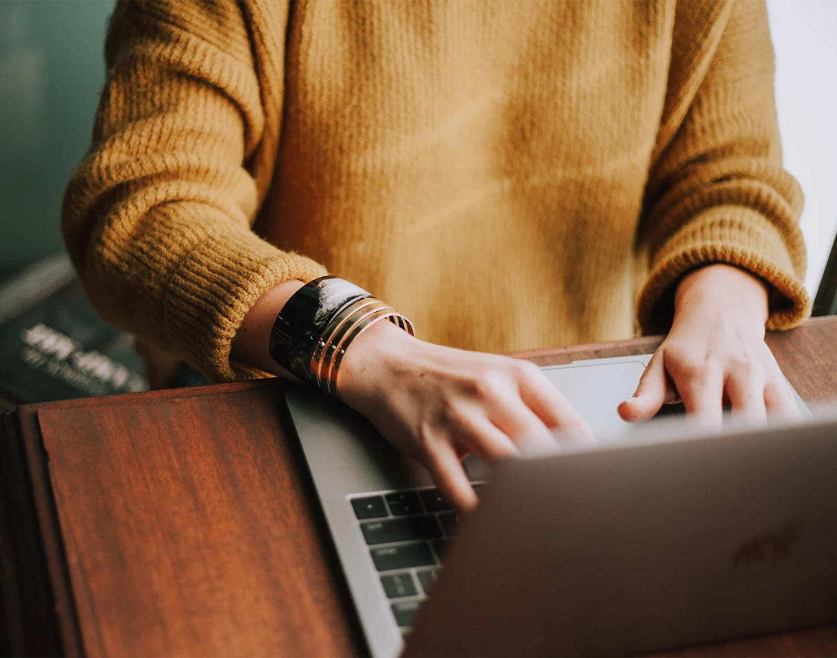 christin-hume-Hcfwew744z4-unsplash Person typing on computer